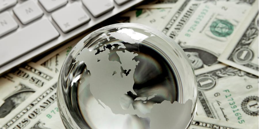 glass-globe-with-keyboard-and-dollar-bills-picture-id171589842 (1)